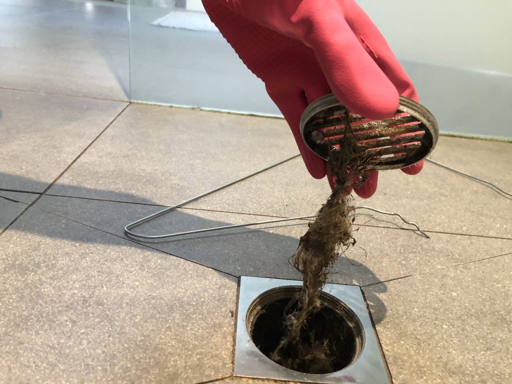 Why is my shower draining slowly?